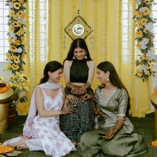 Bride enjoying her Mehndi ceremony with family